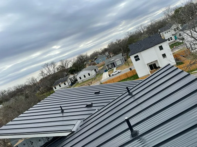 Standing seam metal roof panels with vents for Skylight Repair in Aubrey